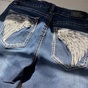 Dark blue Love Indigo jeans with wings embellished on the back pockets